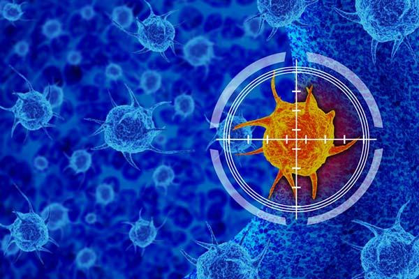 photo illustration of an orange cancer cell on a field of vivid blue, with white cross-hairs and surrounded by white concentric circles; concept is immunotherapy treatment for cancer 